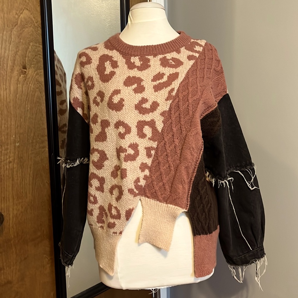 Boutique style sweater. Cheetah print with denim sleeves